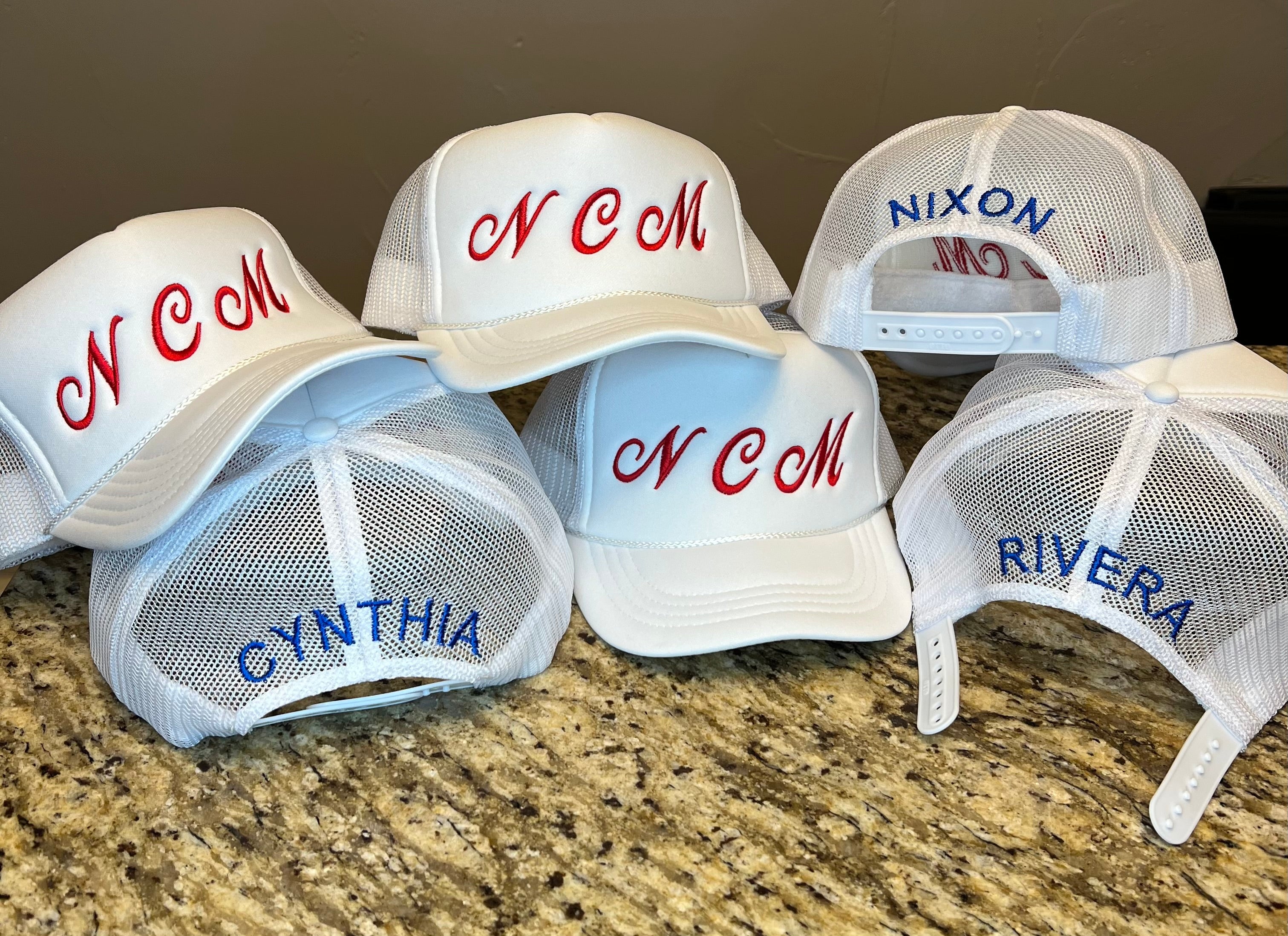 Custom embroidered foam trucker hats made for a client. Embroidery on front and back of hats.